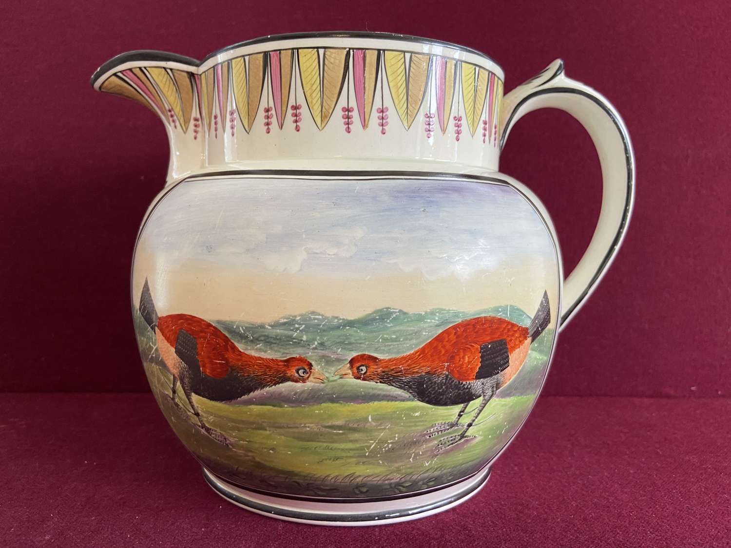 A fine Creamware Cock Fighting jug dated 1824