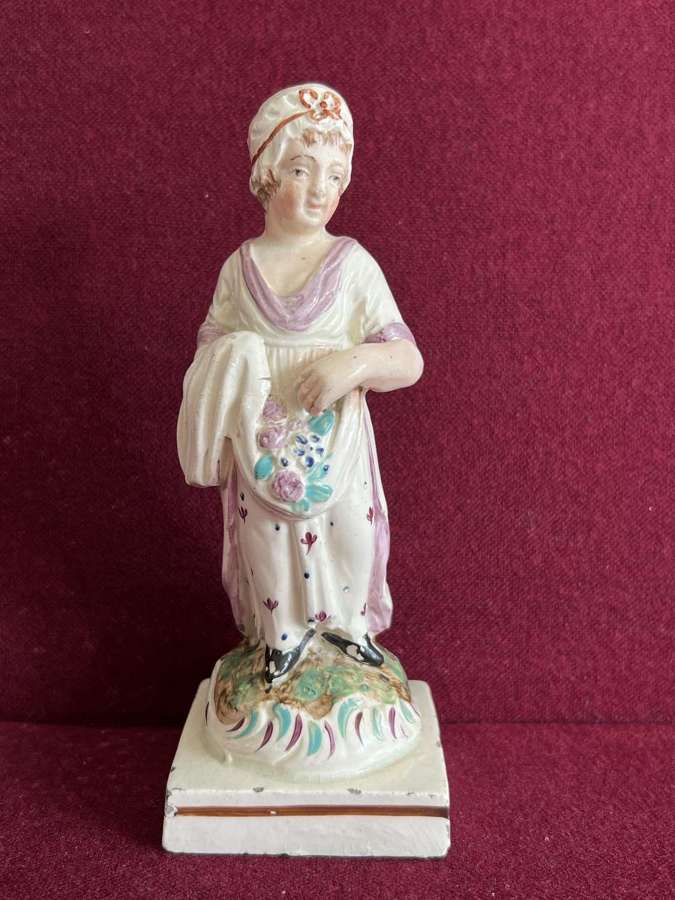 Staffordshire Pearlware figure of Flower Seller c.1810-1820