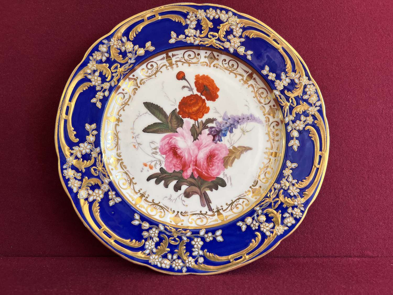 A Coalport Porcelain Dinner Plate decorated by Thomas Brentnall