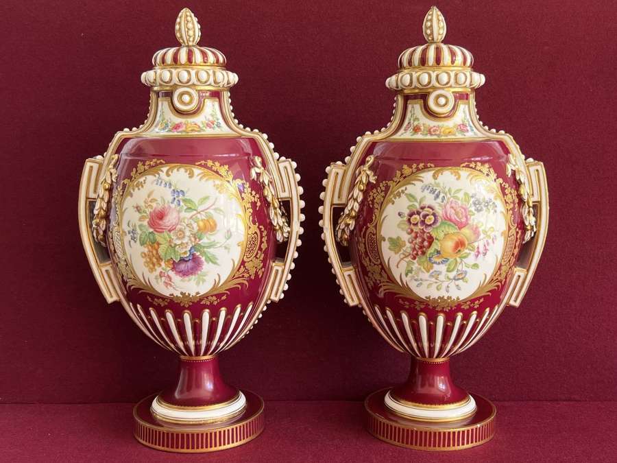 A pair of Coalport porcelain vases decorated by William Cook