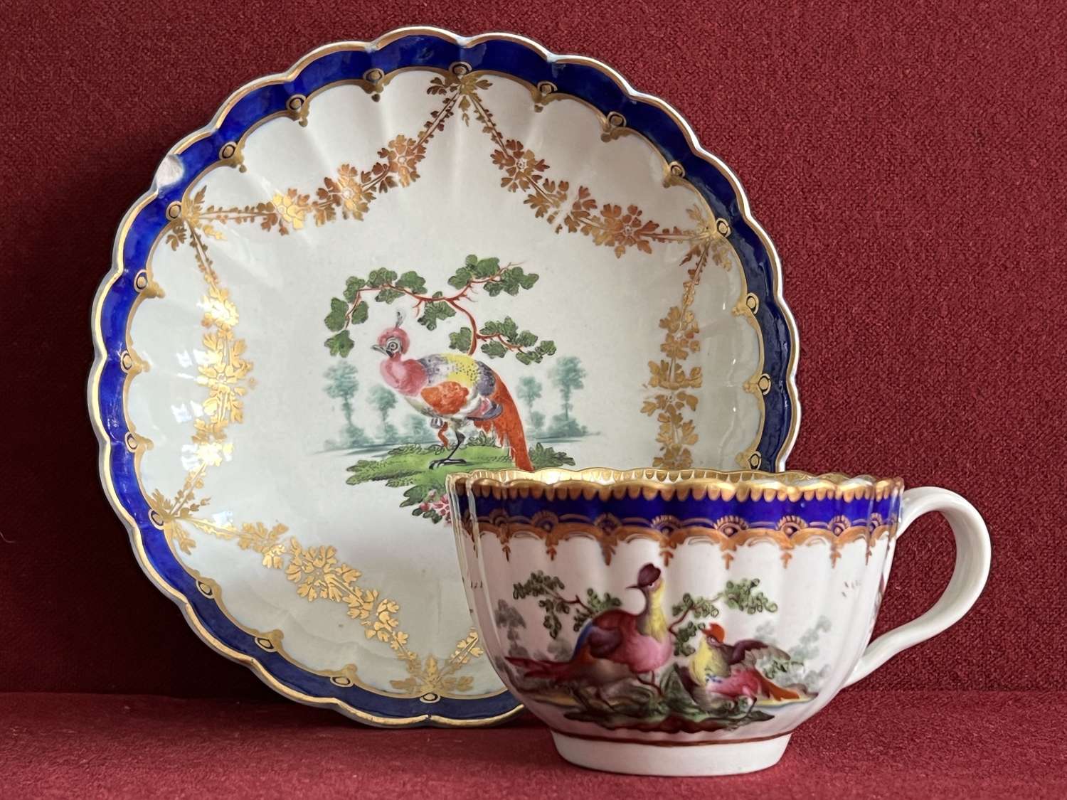 A Worcester Porcelain Teacup & Saucer decorated with Fancy Birds c1770